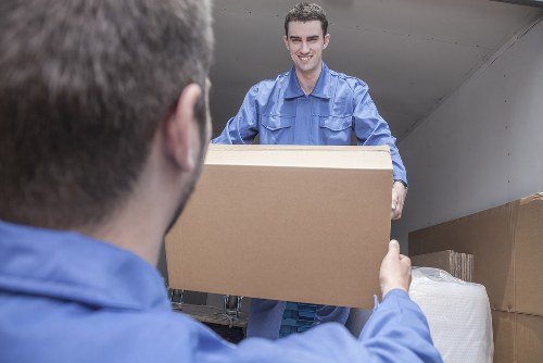 Removal team planning a move in a Southwark residential street