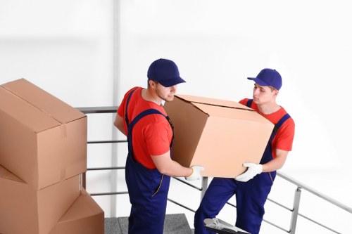 Moving boxes and furniture during a Southwark home removal