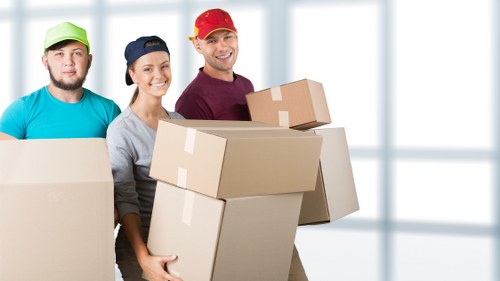 Office relocation planning in Southwark with moving boxes and workstation items