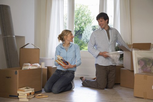 Movers handling a Southwark residential move with boxes and furniture