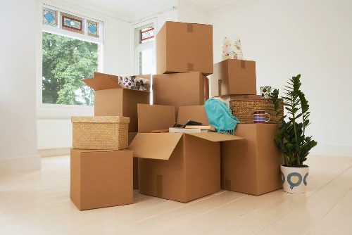 Careful packing of office equipment for a move in Southwark